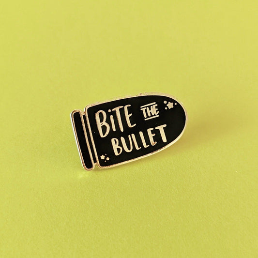 Bite the Bullet Enamel Pin